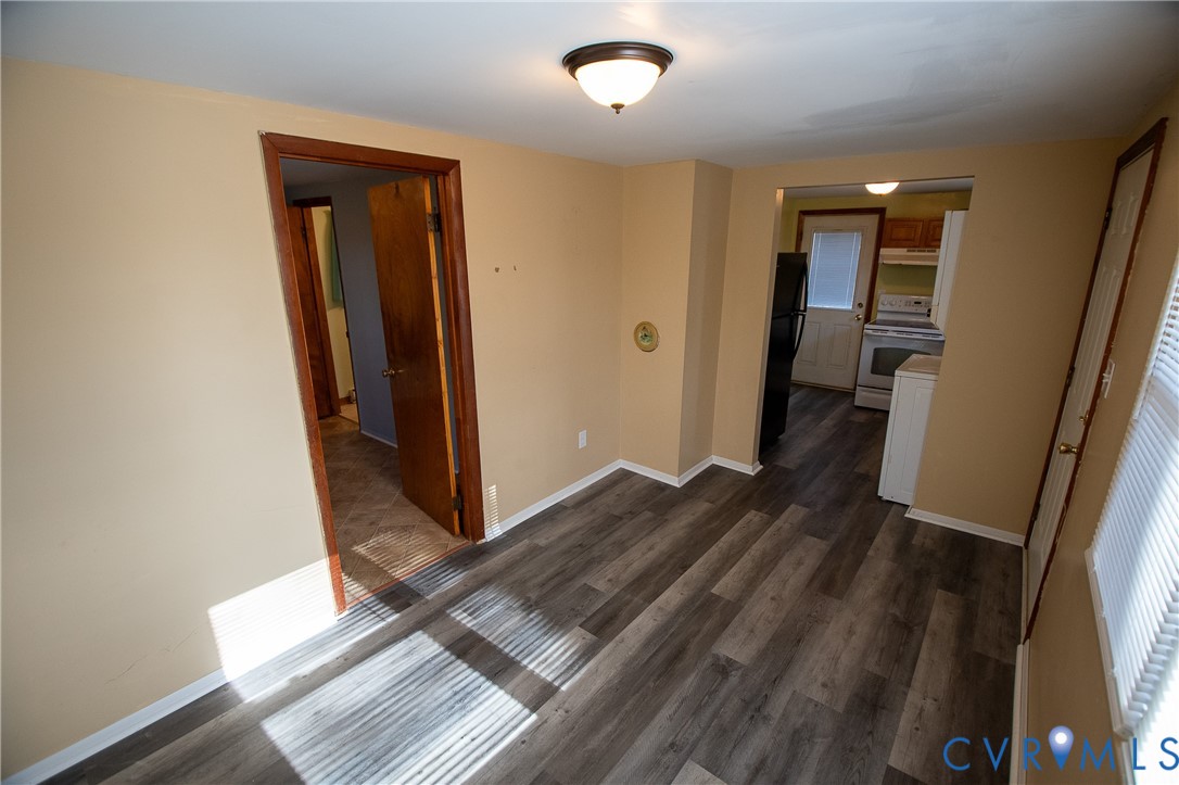 11750 Bevils Bridge Road Amelia Court House, VA 23002 - Photo 9 of 15 Unfurnished room featuring dark wood finished floo