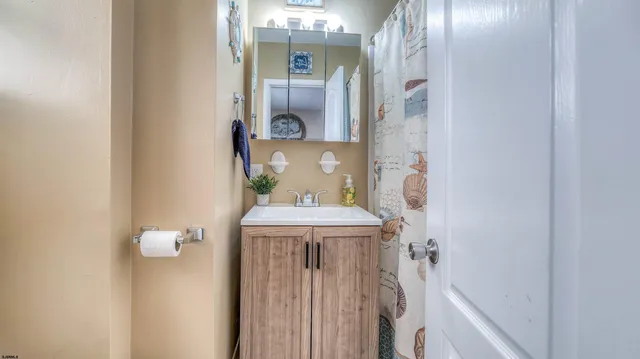 a bathroom with a sink and mirror