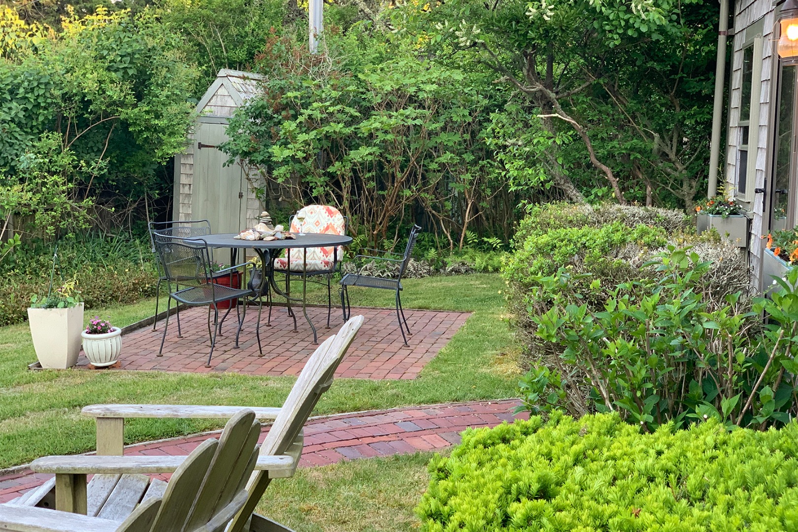 42 North Liberty Street Nantucket, MA 02554 - Photo 3 of 20 a garden view with a seating space