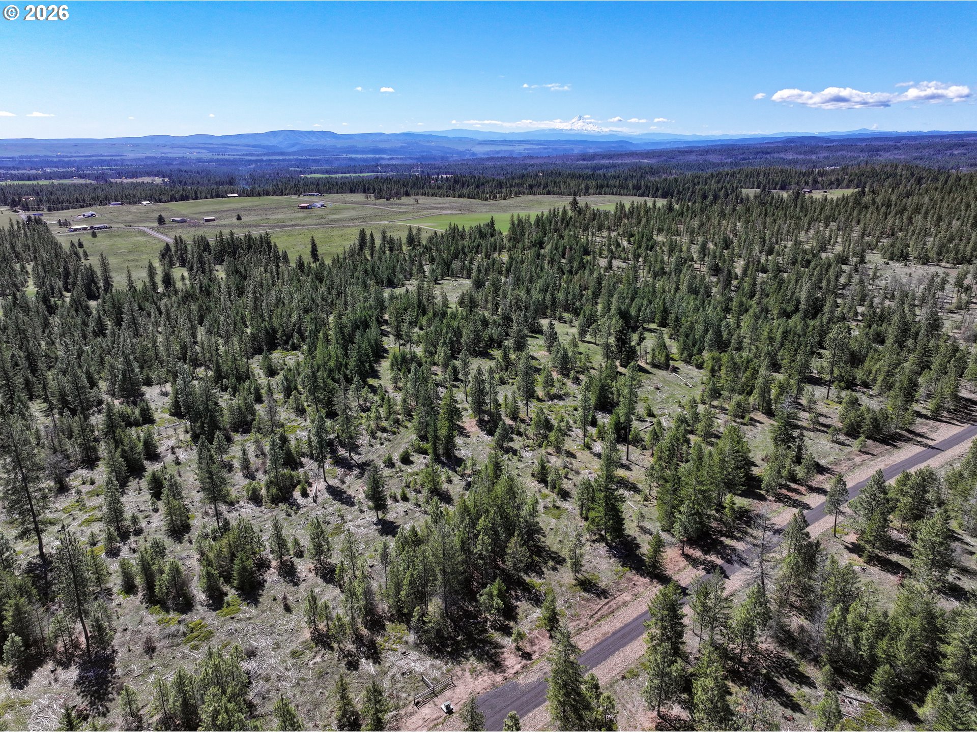 Ginger Way, Unit 4 Goldendale, WA 98620 - Photo 2 of 11 a view of a city with lush green forest