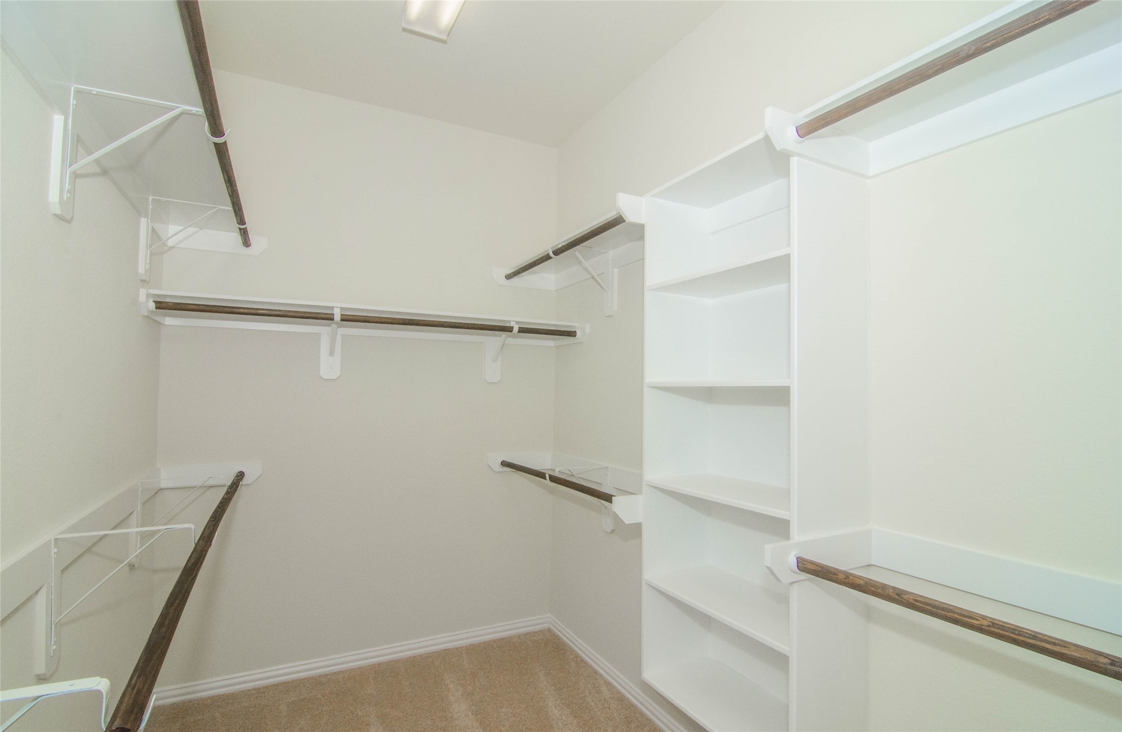 18403 Weeping Spring Drive Cypress, TX 77429 - Photo 20 of 25 a view of walk in closet with empty racks