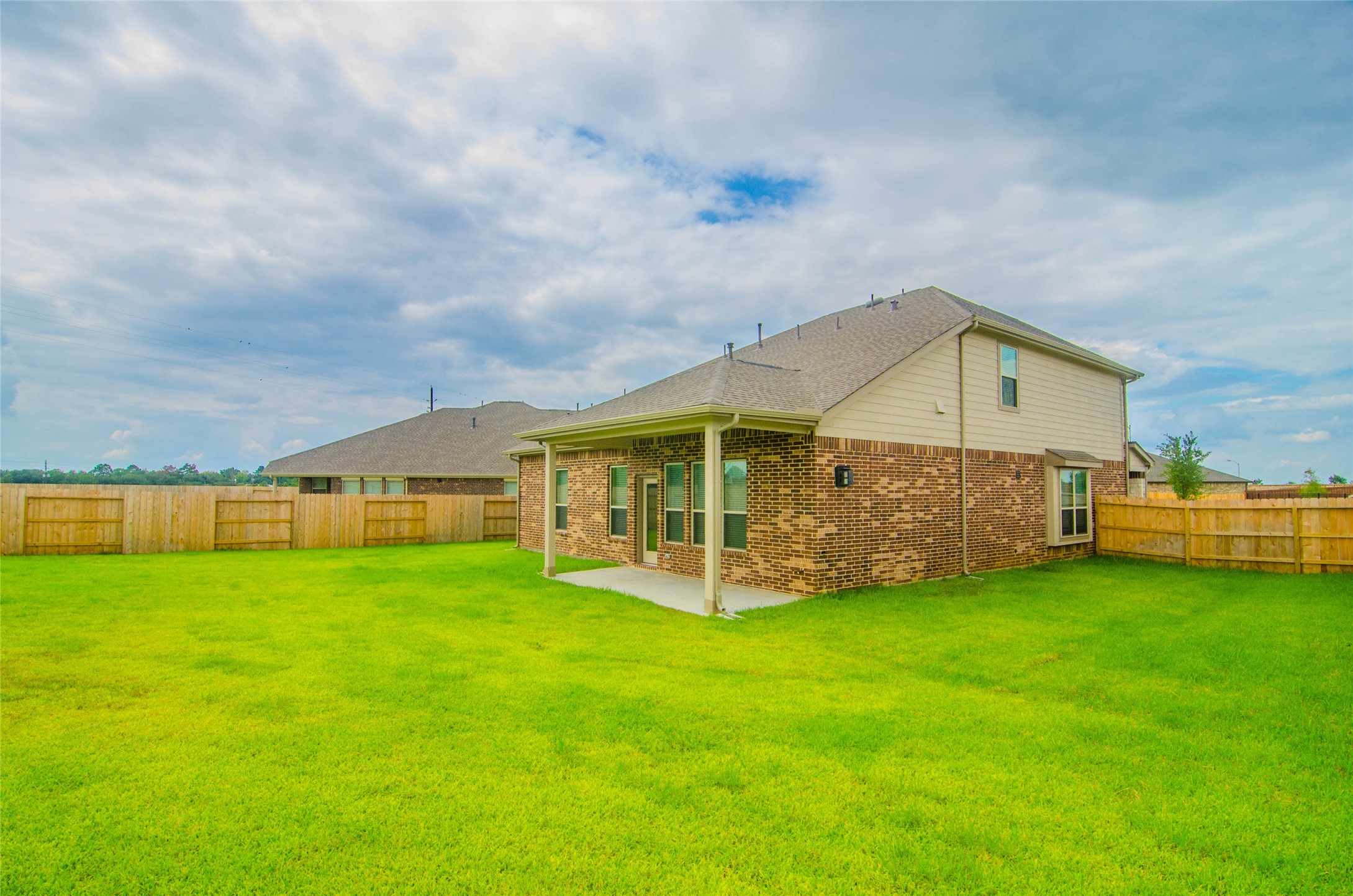 18403 Weeping Spring Drive Cypress, TX 77429 - Photo 23 of 25 a view of a house with a yard and sitting area