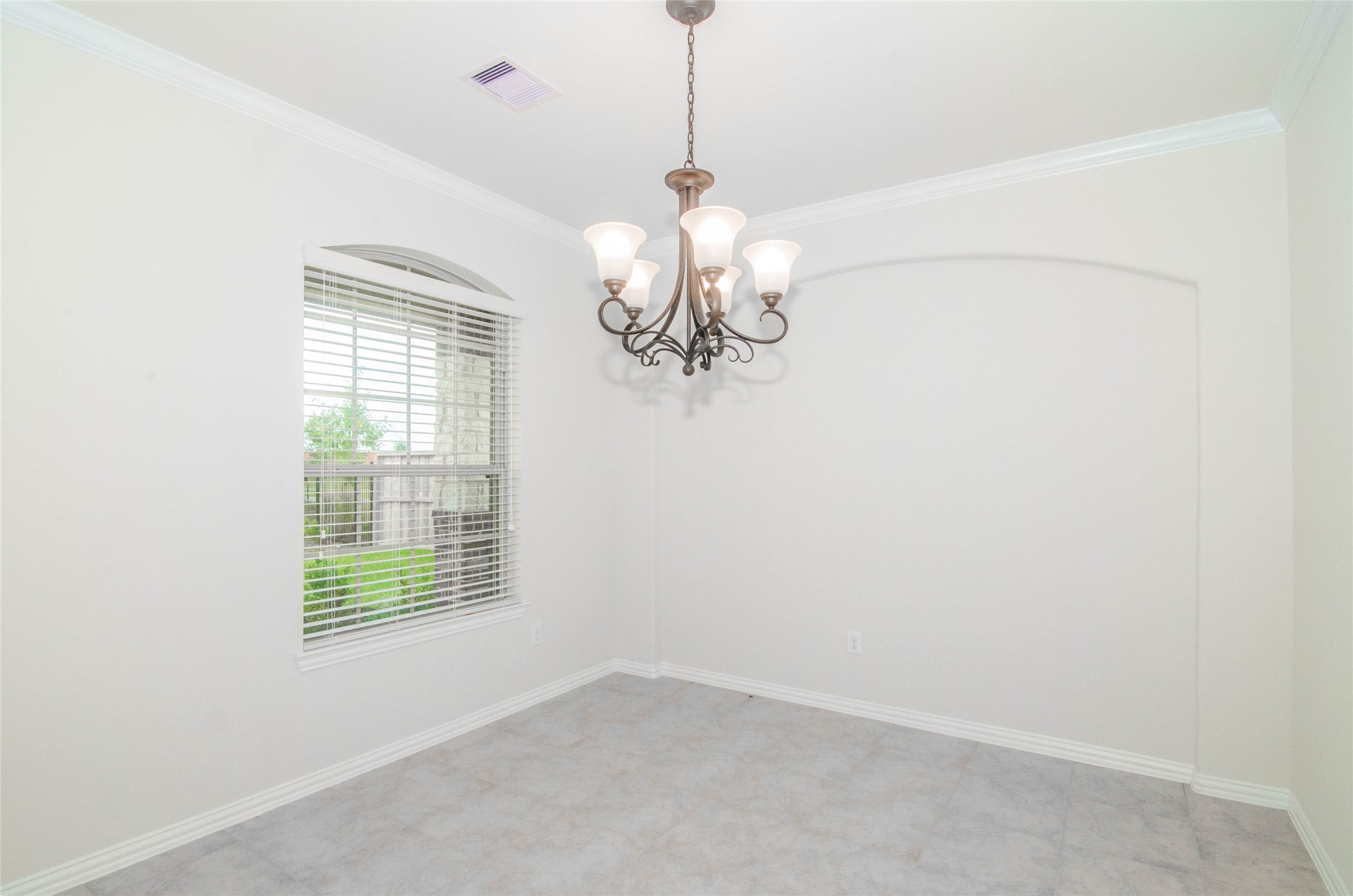 18403 Weeping Spring Drive Cypress, TX 77429 - Photo 6 of 25 a window in a room with a chandelier
