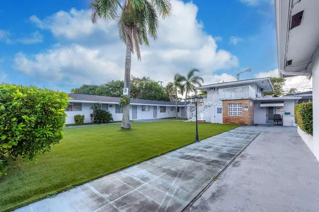 a view of a house with a back yard
