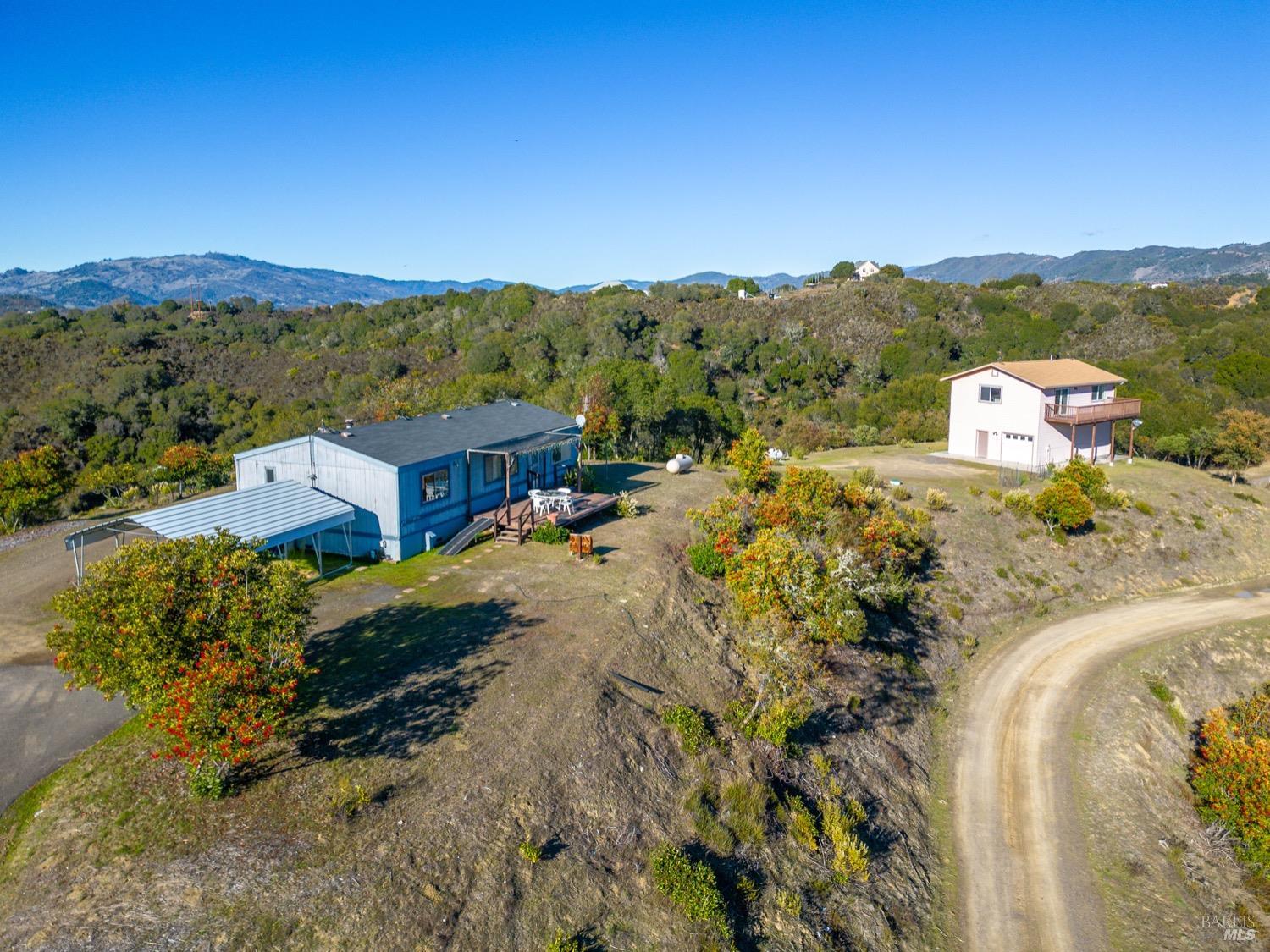 5090 Lake Ridge Road Ukiah, CA 95482 - Photo 1 of 1 a view of a town with mountains in the background