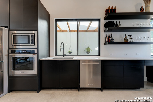 417 Southwick Ranch Johnson City, TX 78636 - Photo 13 of 45 a kitchen with stainless steel appliances a stove and a microwave