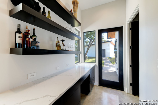 417 Southwick Ranch Johnson City, TX 78636 - Photo 14 of 45 a view of a hallway with wooden floor and windows