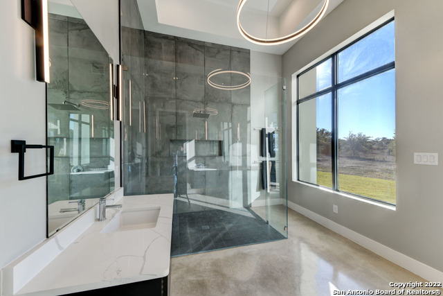 417 Southwick Ranch Johnson City, TX 78636 - Photo 18 of 45 a spacious bathroom with a bathtub and a sink