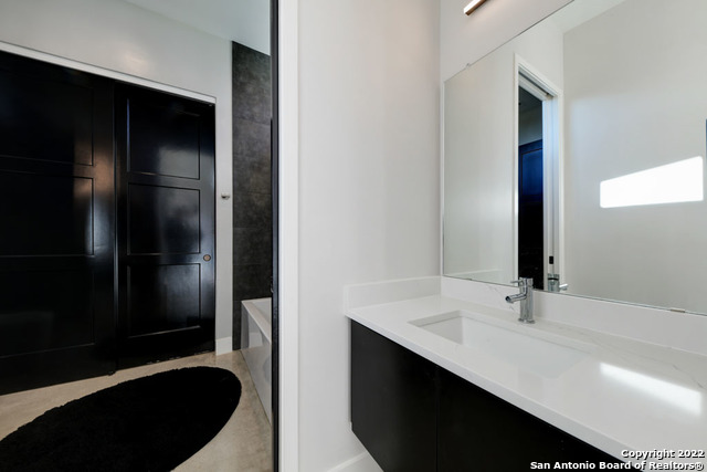 417 Southwick Ranch Johnson City, TX 78636 - Photo 19 of 45 a bathroom with a sink and a mirror