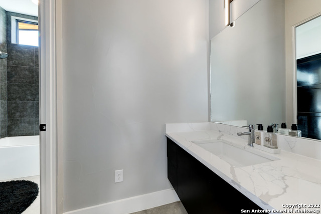 417 Southwick Ranch Johnson City, TX 78636 - Photo 21 of 45 a bathroom with a sink and a mirror