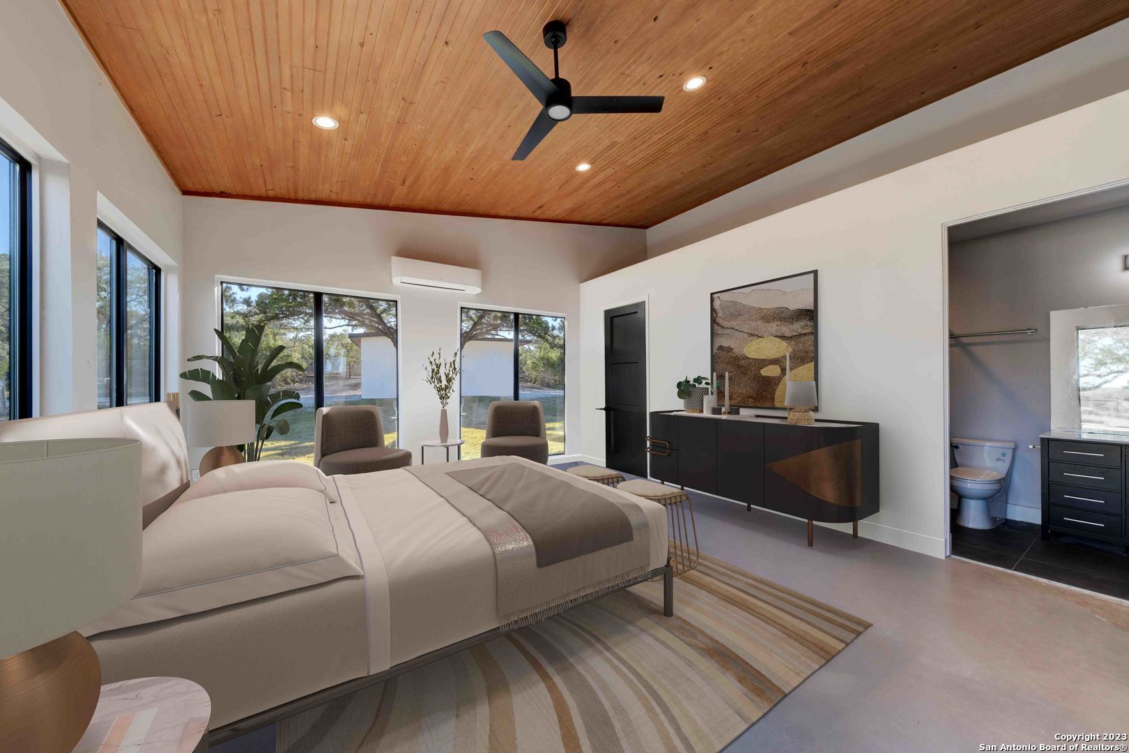 417 Southwick Ranch Johnson City, TX 78636 - Photo 22 of 45 a bedroom with a large bed couch and a window