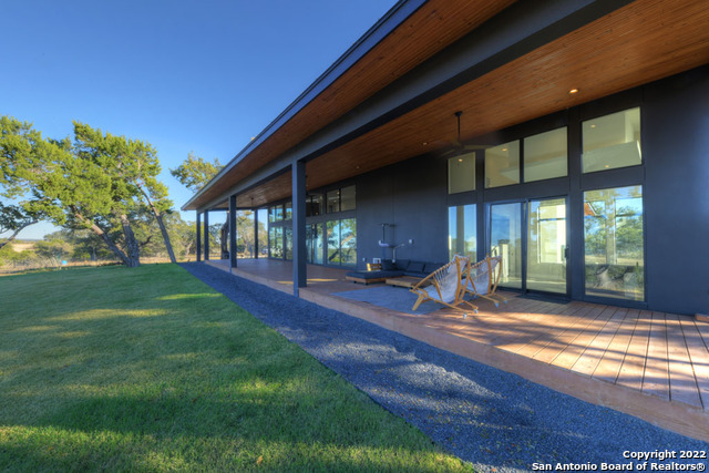 417 Southwick Ranch Johnson City, TX 78636 - Photo 29 of 45 a view of a house with backyard and porch