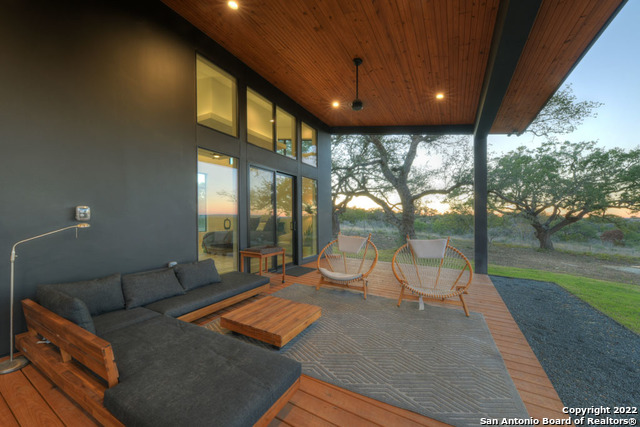 417 Southwick Ranch Johnson City, TX 78636 - Photo 31 of 45 a living room with furniture and a floor to ceiling window