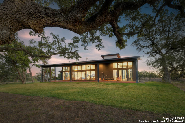 417 Southwick Ranch Johnson City, TX 78636 - Photo 36 of 45 a front view of a house with a garden