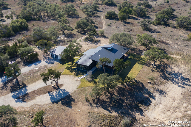 417 Southwick Ranch Johnson City, TX 78636 - Photo 37 of 45 a view of outside house with a lot of trees