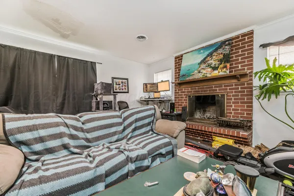 a bedroom with a bed and a fireplace