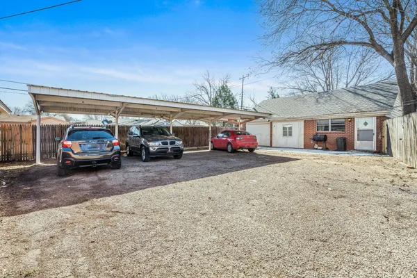 a view of car parked in front of house