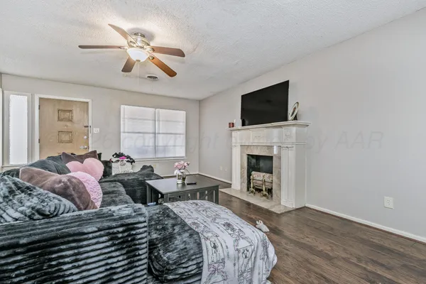 a bedroom with a bed and a fireplace