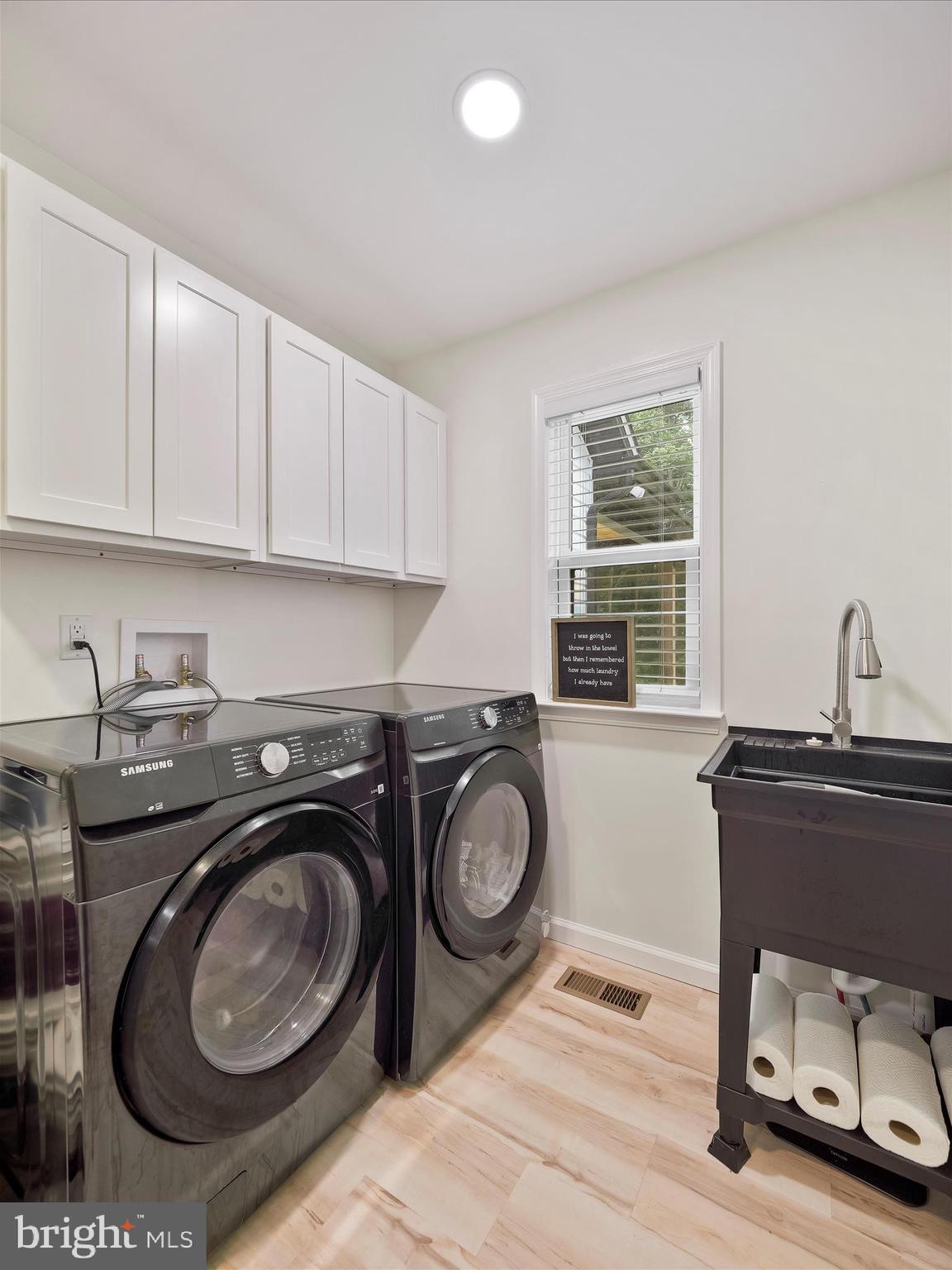 2144 Hinton Road Kearneysville, WV 25430 - Photo 21 of 45 Laundry room with soaking sink and cabinetry