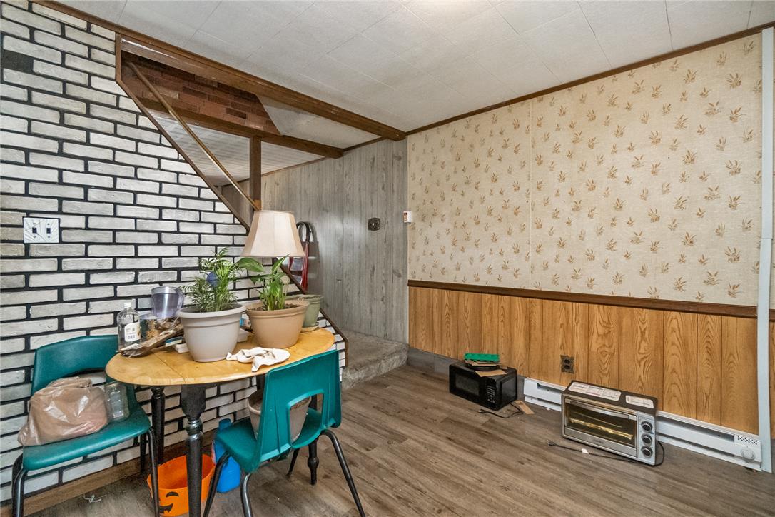 377 West Ridge Street Lansford, PA 18232 - Photo 6 of 39 A well-lit, cozy interior space with mixed wall textures and natural wood accents.