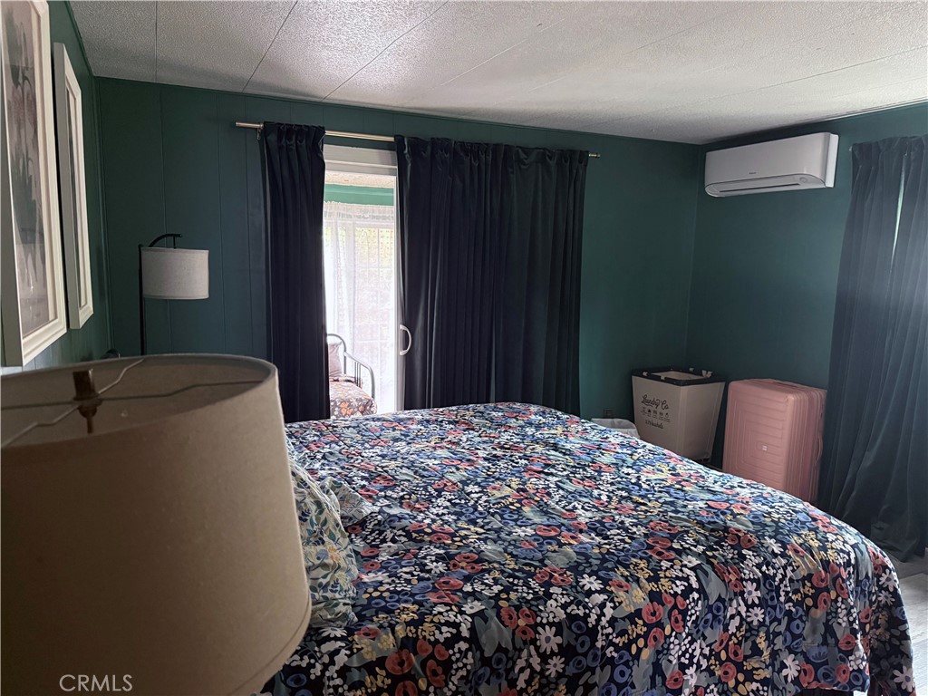 3909 Reche Road, Unit 112 Fallbrook, CA 92028 - Photo 18 of 22 a bedroom with a bed and a window