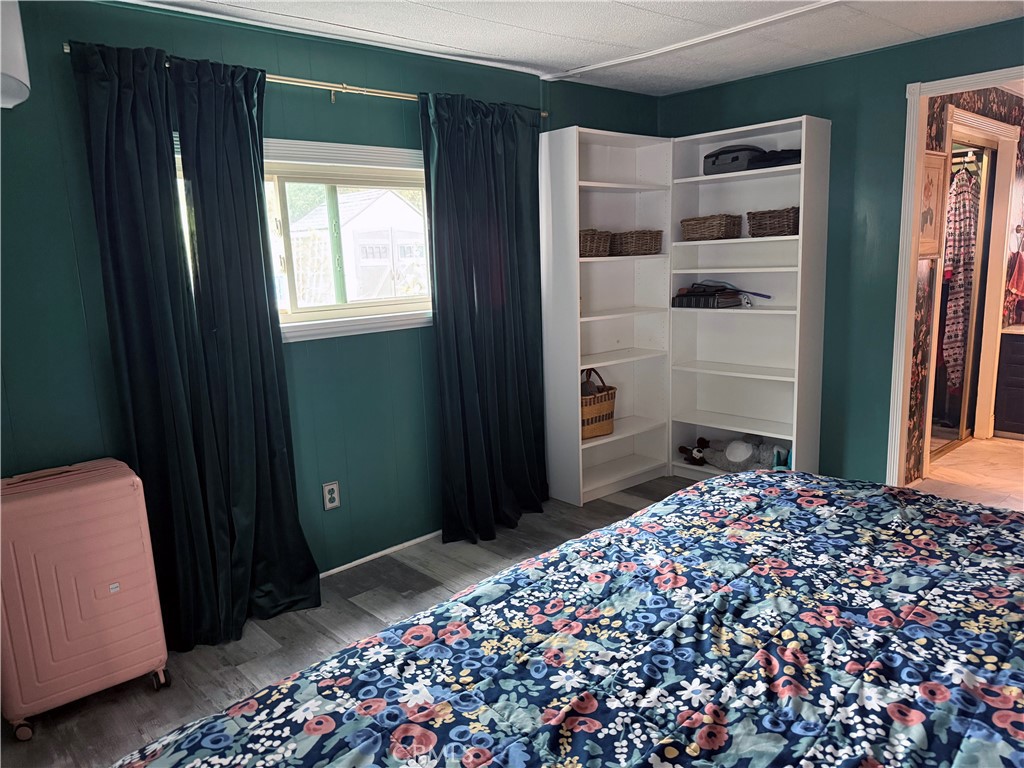 3909 Reche Road, Unit 112 Fallbrook, CA 92028 - Photo 19 of 22 a bedroom with a bed and a window