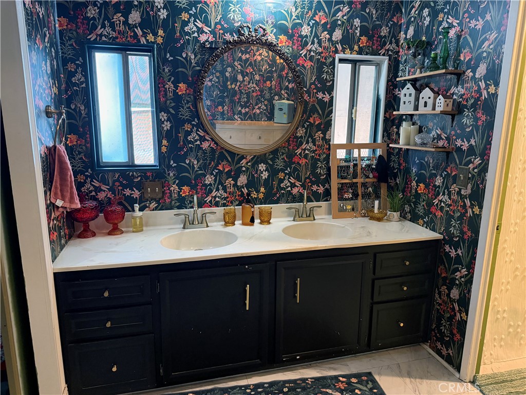 3909 Reche Road, Unit 112 Fallbrook, CA 92028 - Photo 20 of 22 a bathroom with a sink and a mirror