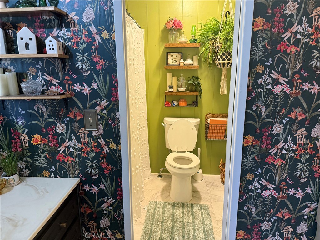 3909 Reche Road, Unit 112 Fallbrook, CA 92028 - Photo 21 of 22 a bathroom with a toilet and a shower