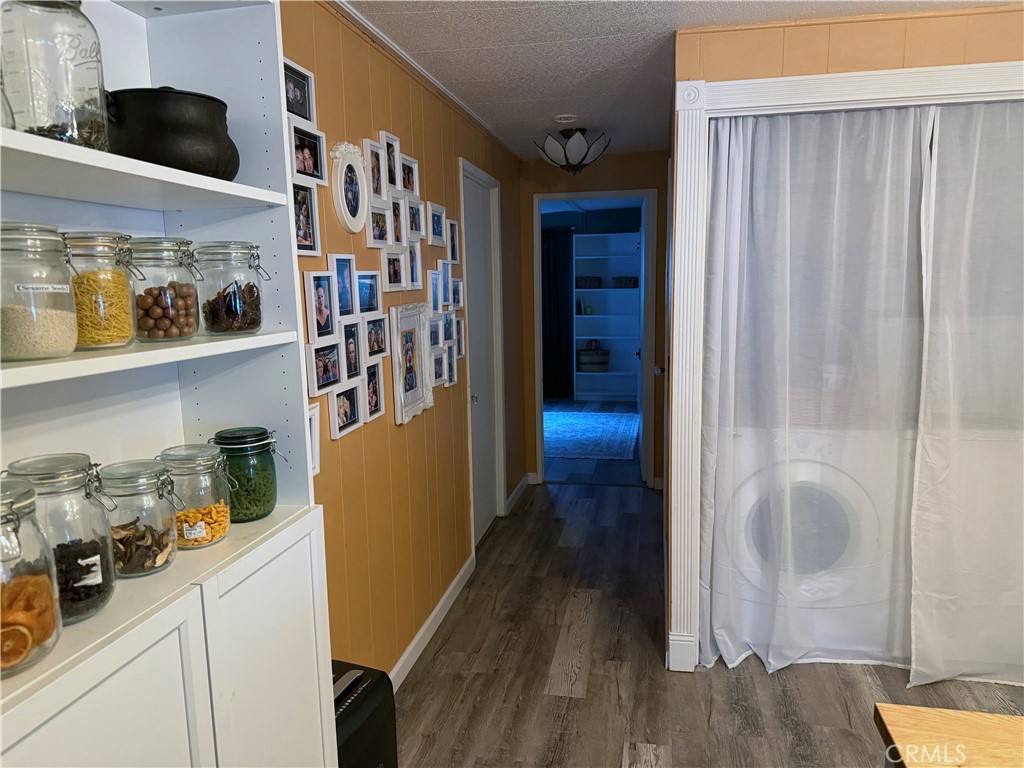 3909 Reche Road, Unit 112 Fallbrook, CA 92028 - Photo 10 of 22 a view of walk in closet with clothes and shoes
