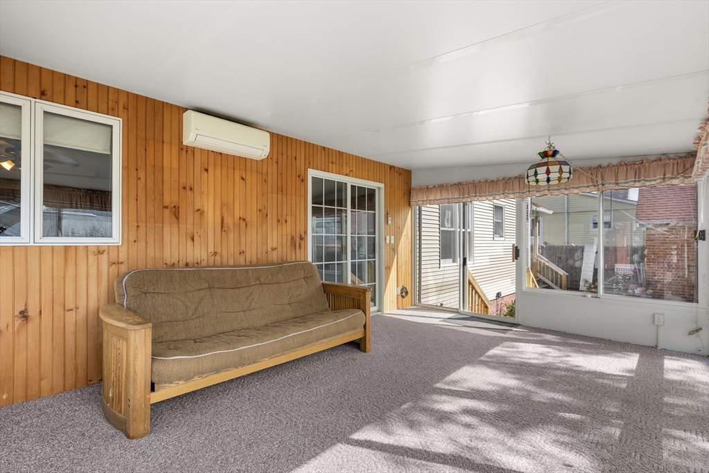 356 East Street, Unit 356 Ludlow, MA 01056 - Photo 10 of 12 a living room with furniture and a large window