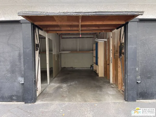 a kitchen with a sink and a mirror
