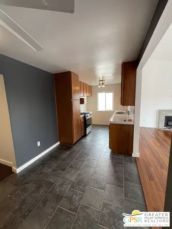 a room with a couch and a stove top oven