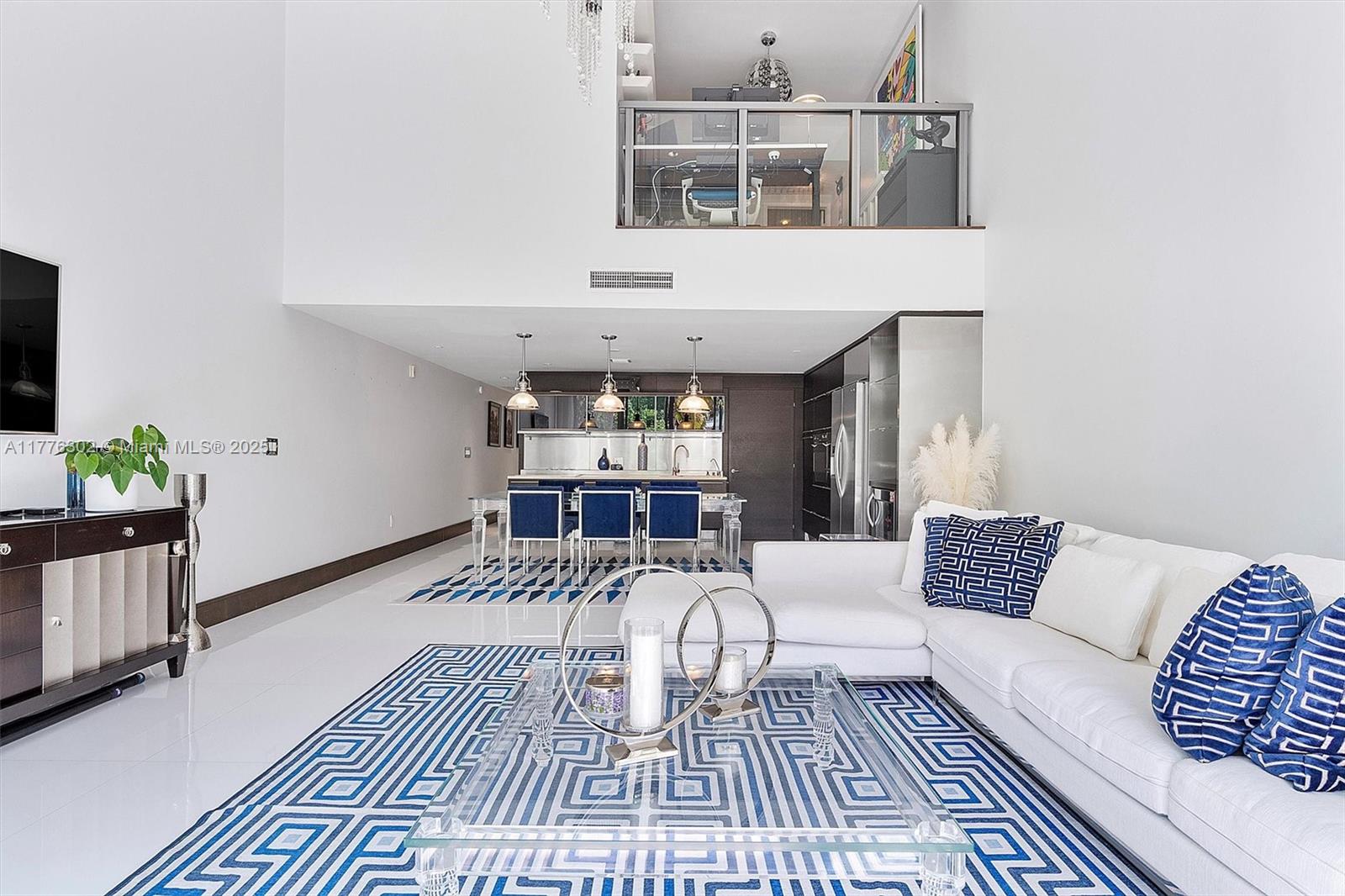 6000 Collins Avenue, Unit 326 Miami Beach, FL 33140 - Photo 13 of 45 a view of a livingroom with furniture and lounge chair