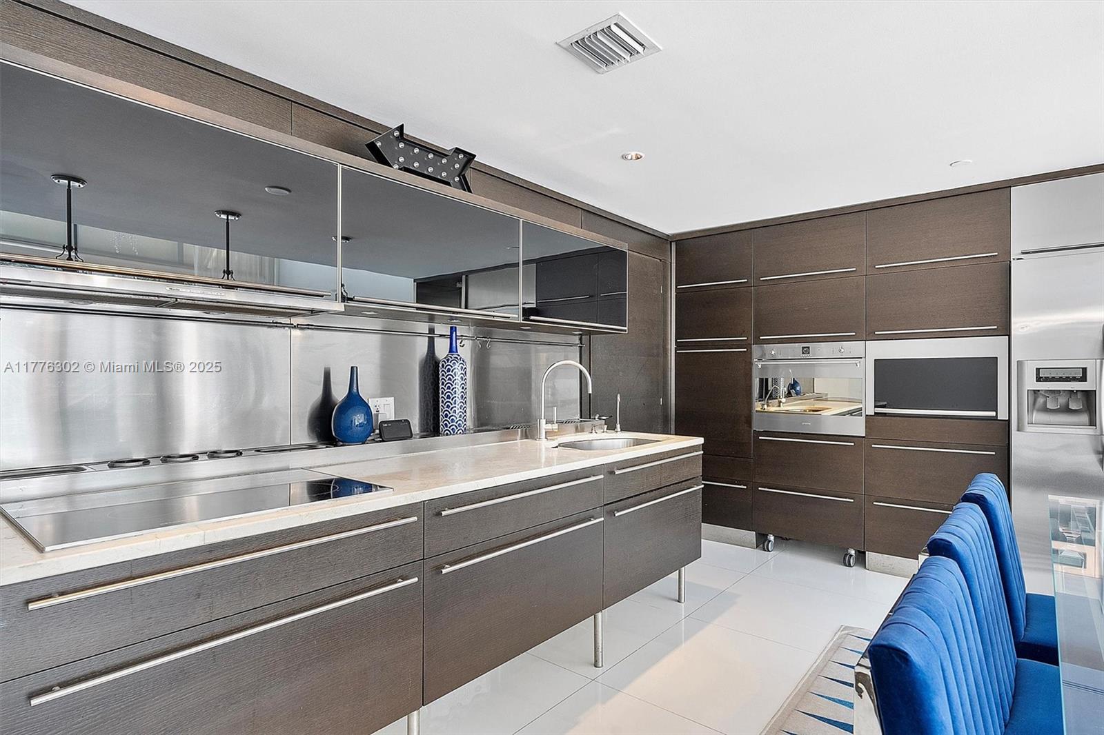 6000 Collins Avenue, Unit 326 Miami Beach, FL 33140 - Photo 18 of 45 a view of a room with stainless steel appliances