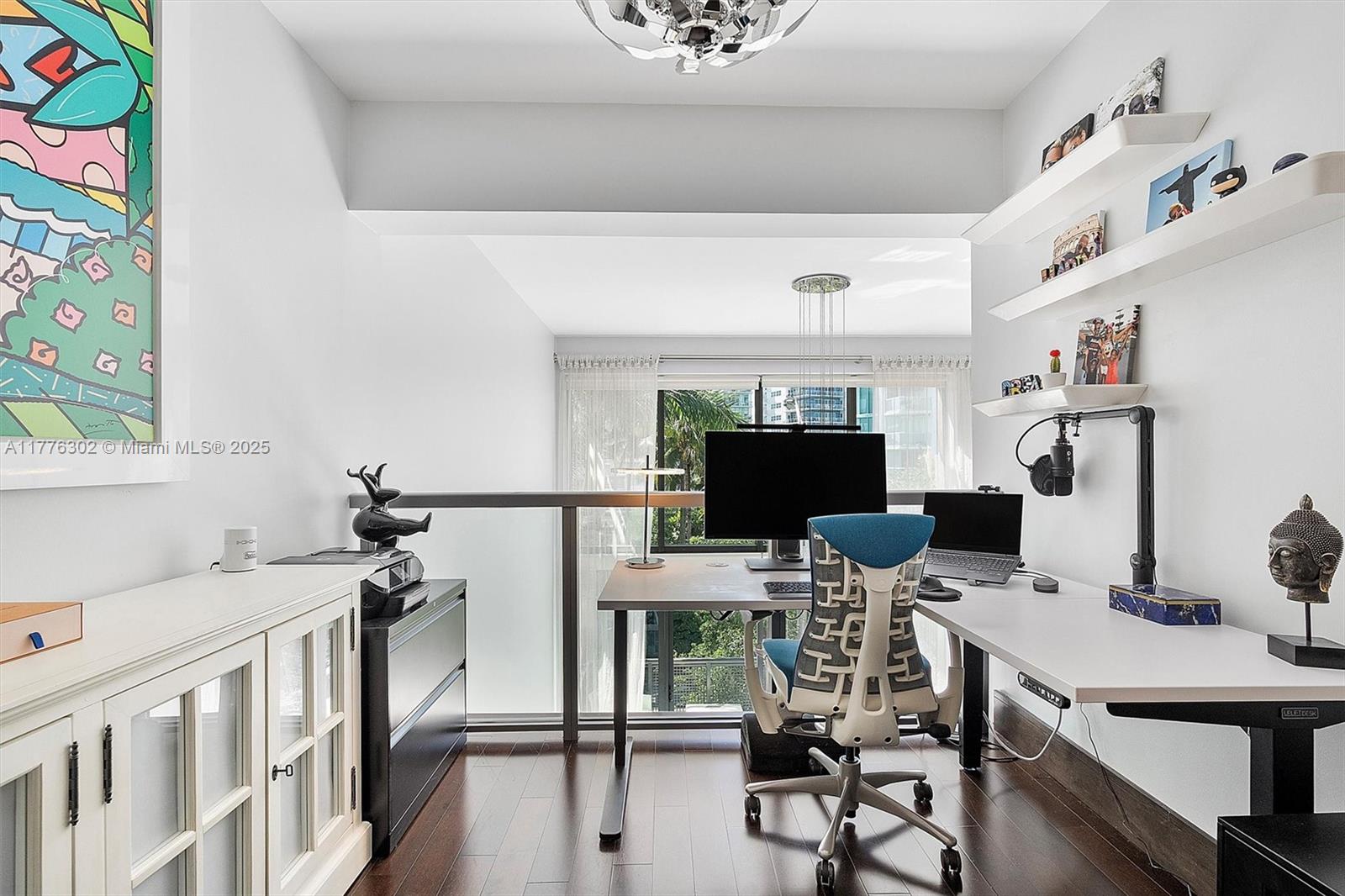 6000 Collins Avenue, Unit 326 Miami Beach, FL 33140 - Photo 22 of 45 a view of a workspace with furniture and a window