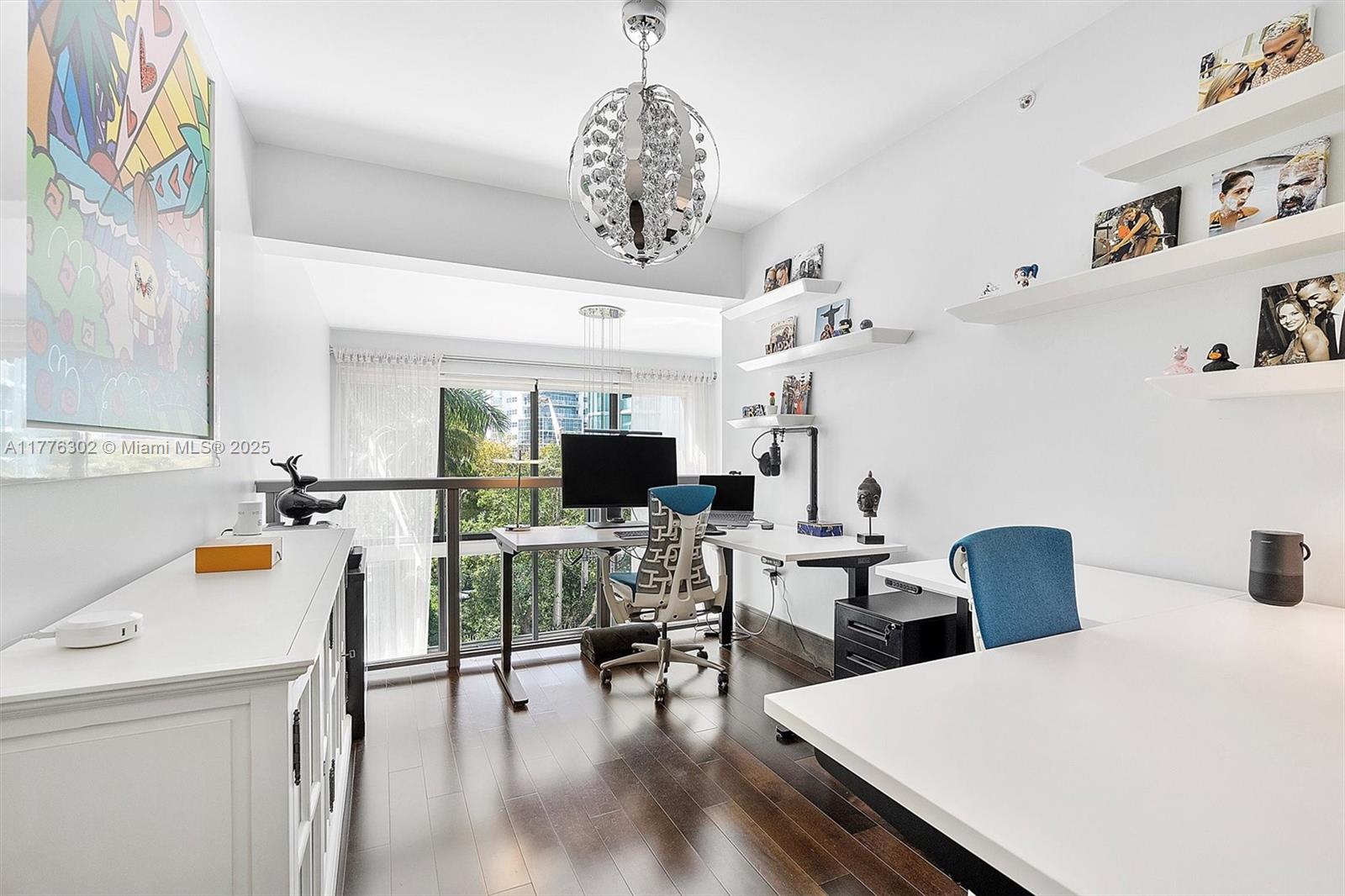 6000 Collins Avenue, Unit 326 Miami Beach, FL 33140 - Photo 23 of 45 a living room with furniture and a flat screen tv