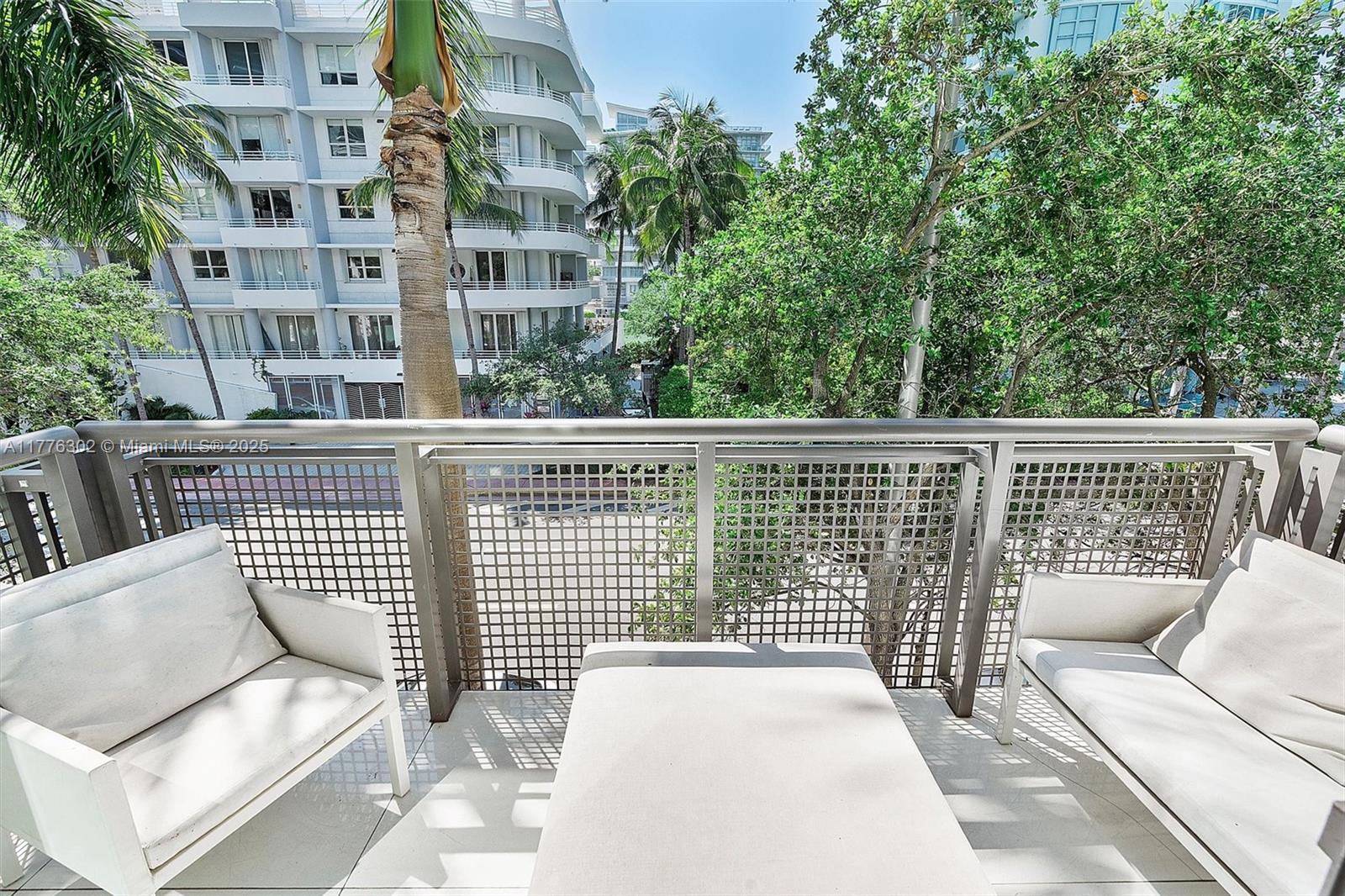 6000 Collins Avenue, Unit 326 Miami Beach, FL 33140 - Photo 9 of 45 a view of a building from a balcony