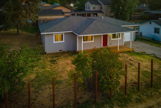 a aerial view of a house with a yard