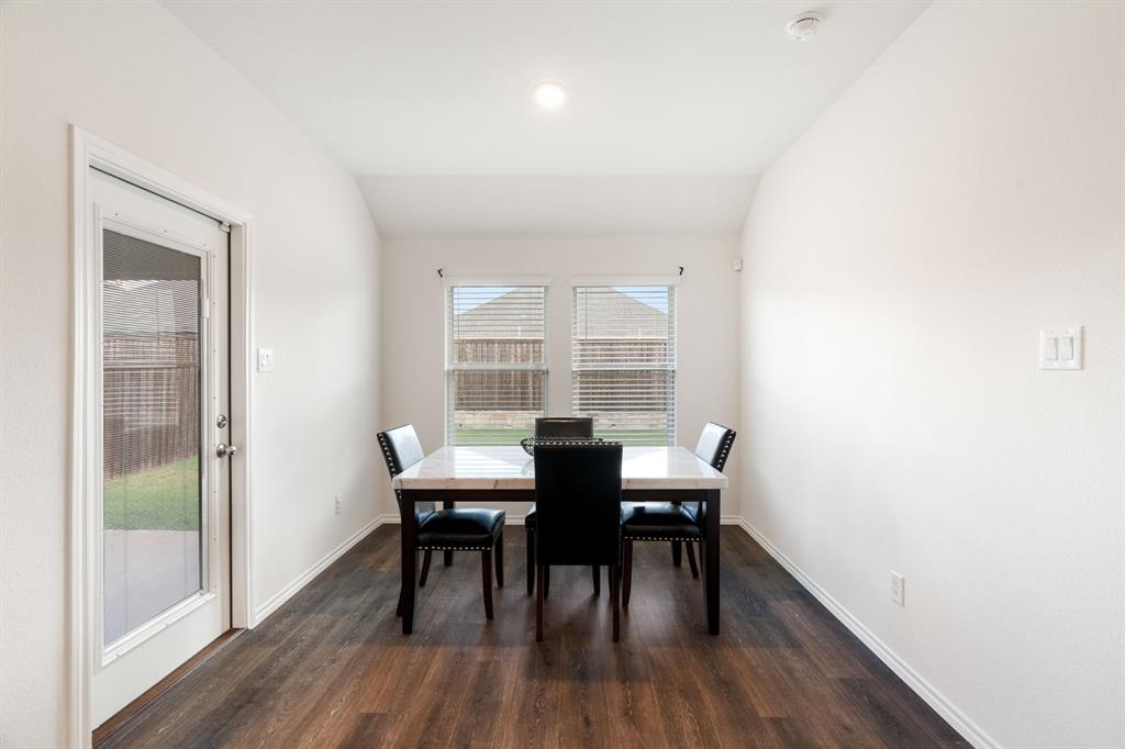 3413 Perman Drive Forney, TX 75126 - Photo 12 of 33 a view of a dining room with furniture and wooden floor