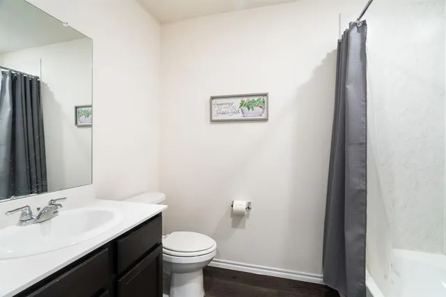 a reading room with furniture and a window