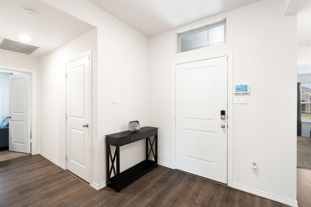3413 Perman Drive Forney, TX 75126 - Photo 23 of 33 a view of empty room with wooden floor