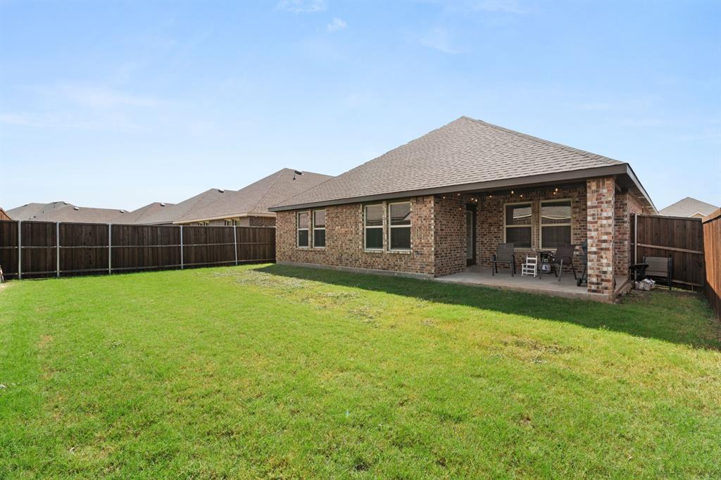 3413 Perman Drive Forney, TX 75126 - Photo 26 of 33 a view of a house with a backyard