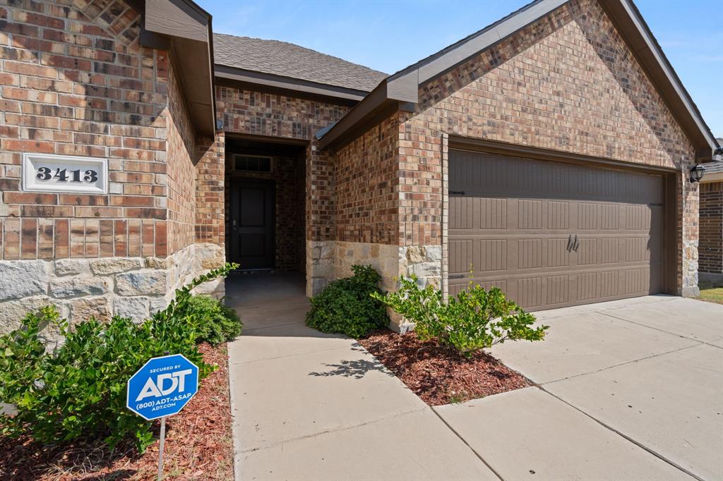 3413 Perman Drive Forney, TX 75126 - Photo 31 of 33 a front view of a house with garden