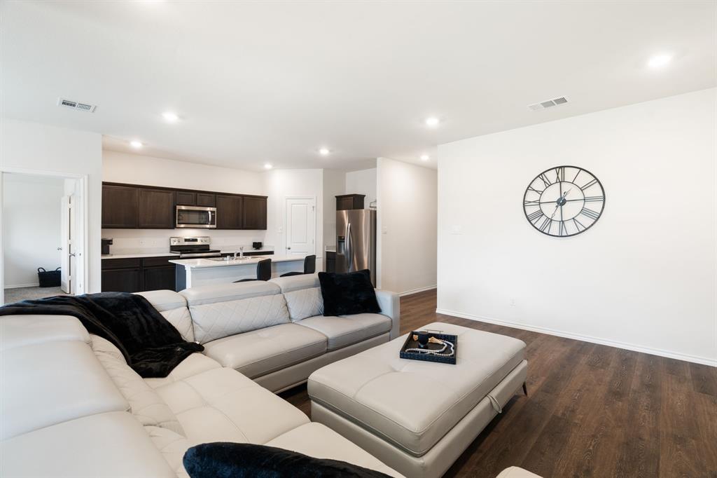 3413 Perman Drive Forney, TX 75126 - Photo 6 of 33 a living room with furniture and view of kitchen