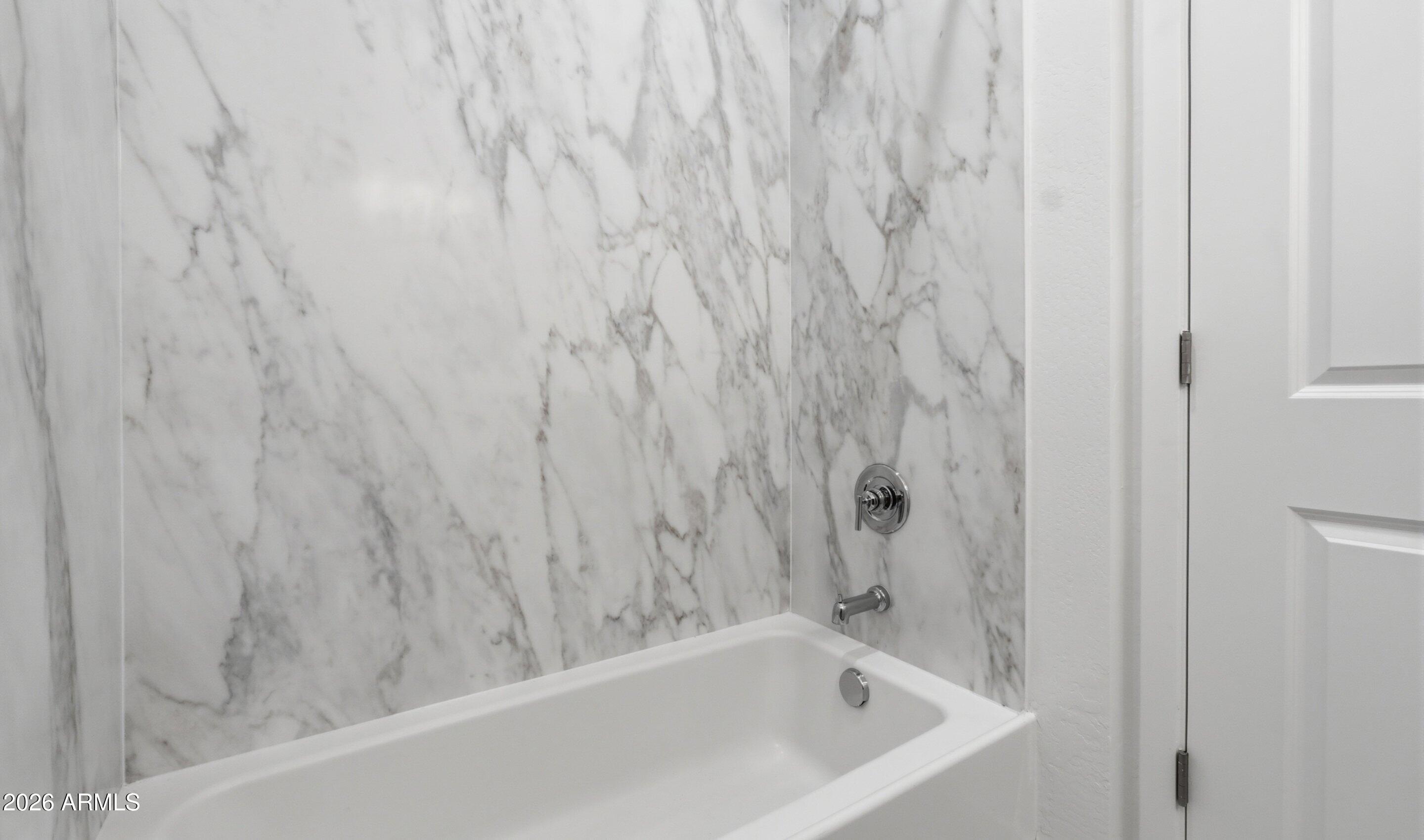 7779 West Sands Road Glendale, AZ 85303 - Photo 18 of 37 a bathroom with a bathtub