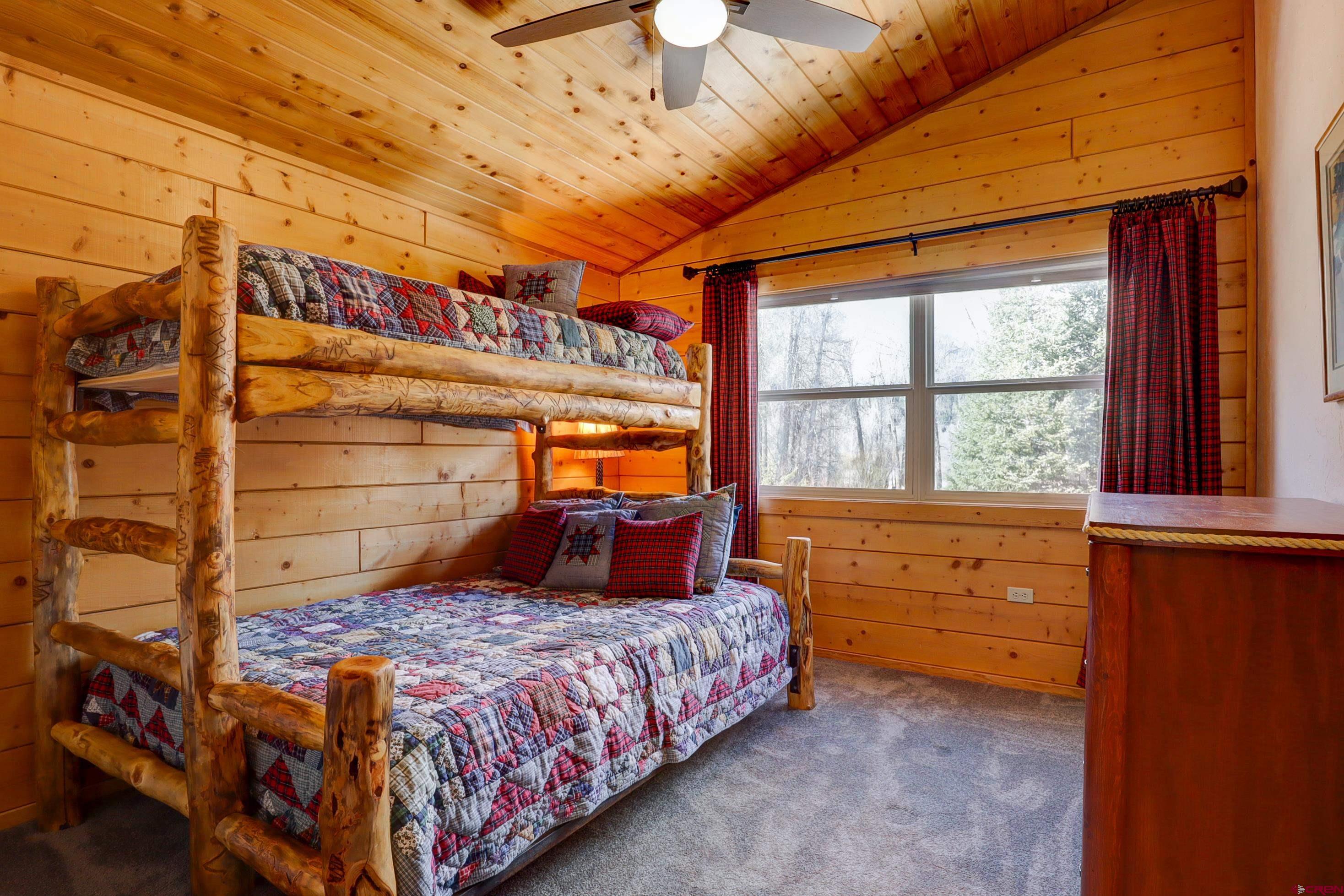 25112 Road 38.1 Dolores, CO 81323 - Photo 22 of 35 a bedroom with a bed and a large window