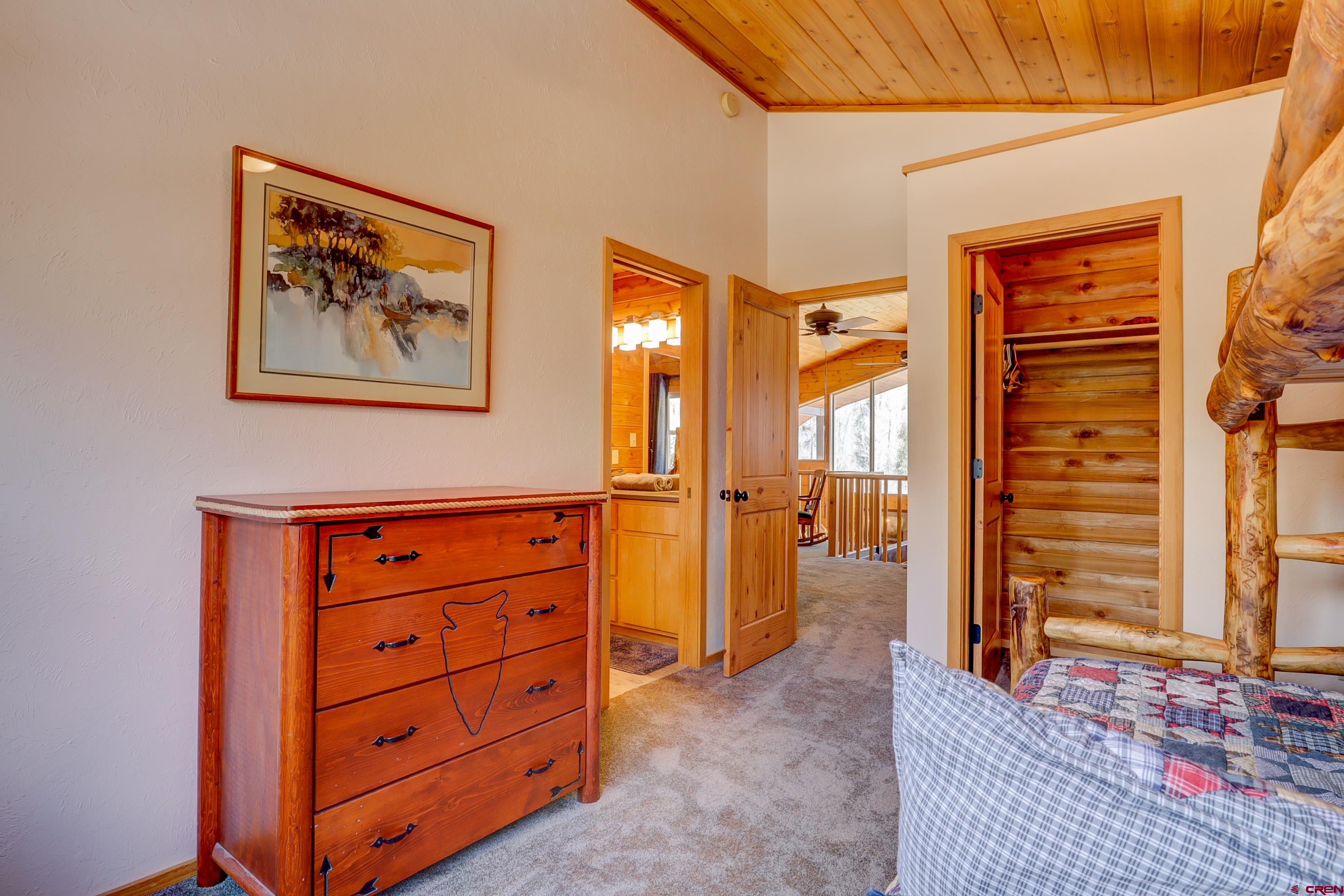 25112 Road 38.1 Dolores, CO 81323 - Photo 23 of 35 an empty room with window and a dresser