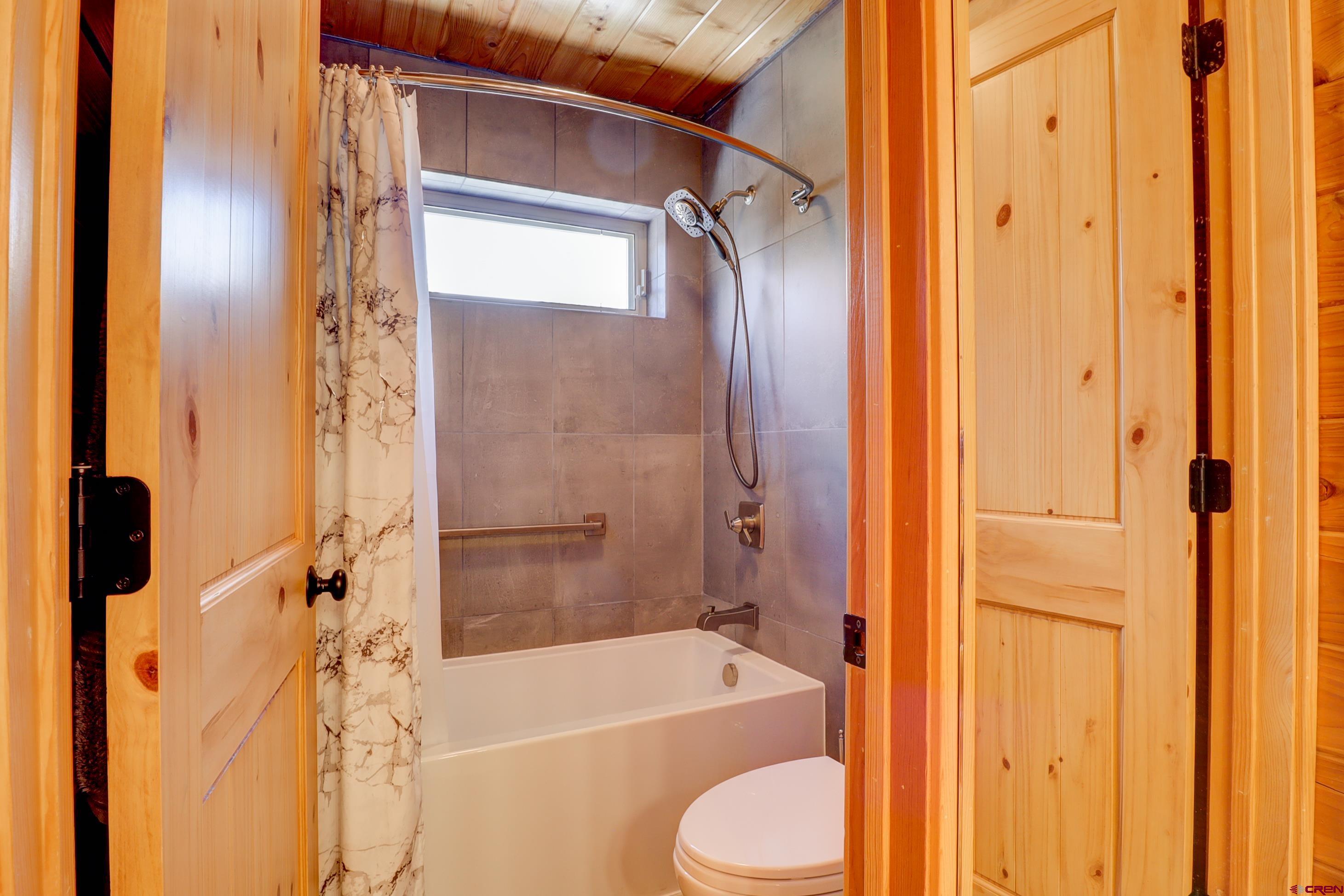 25112 Road 38.1 Dolores, CO 81323 - Photo 25 of 35 a bathroom with a granite countertop bathtub shower and toilet