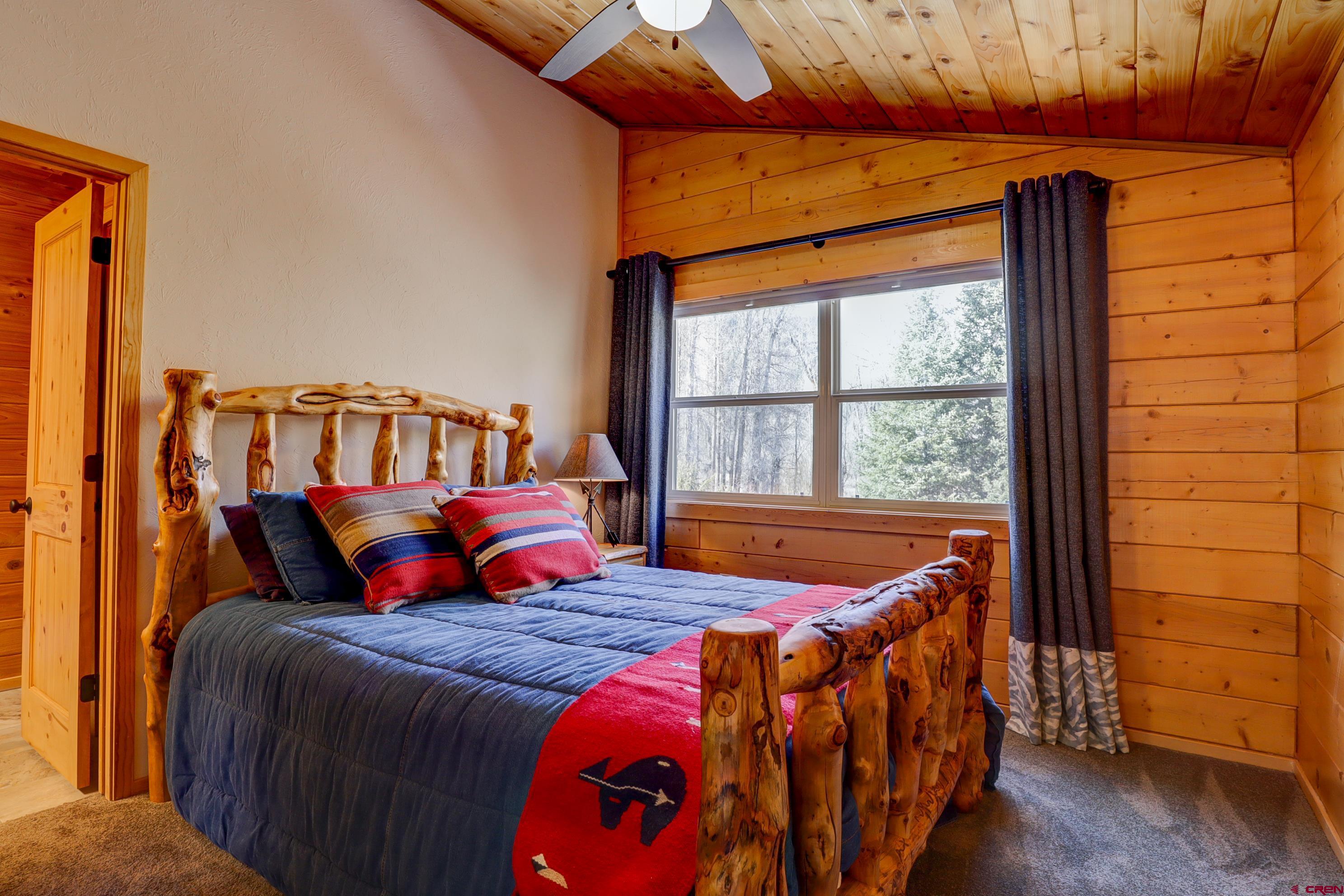 25112 Road 38.1 Dolores, CO 81323 - Photo 26 of 35 a bedroom with a bed and a window