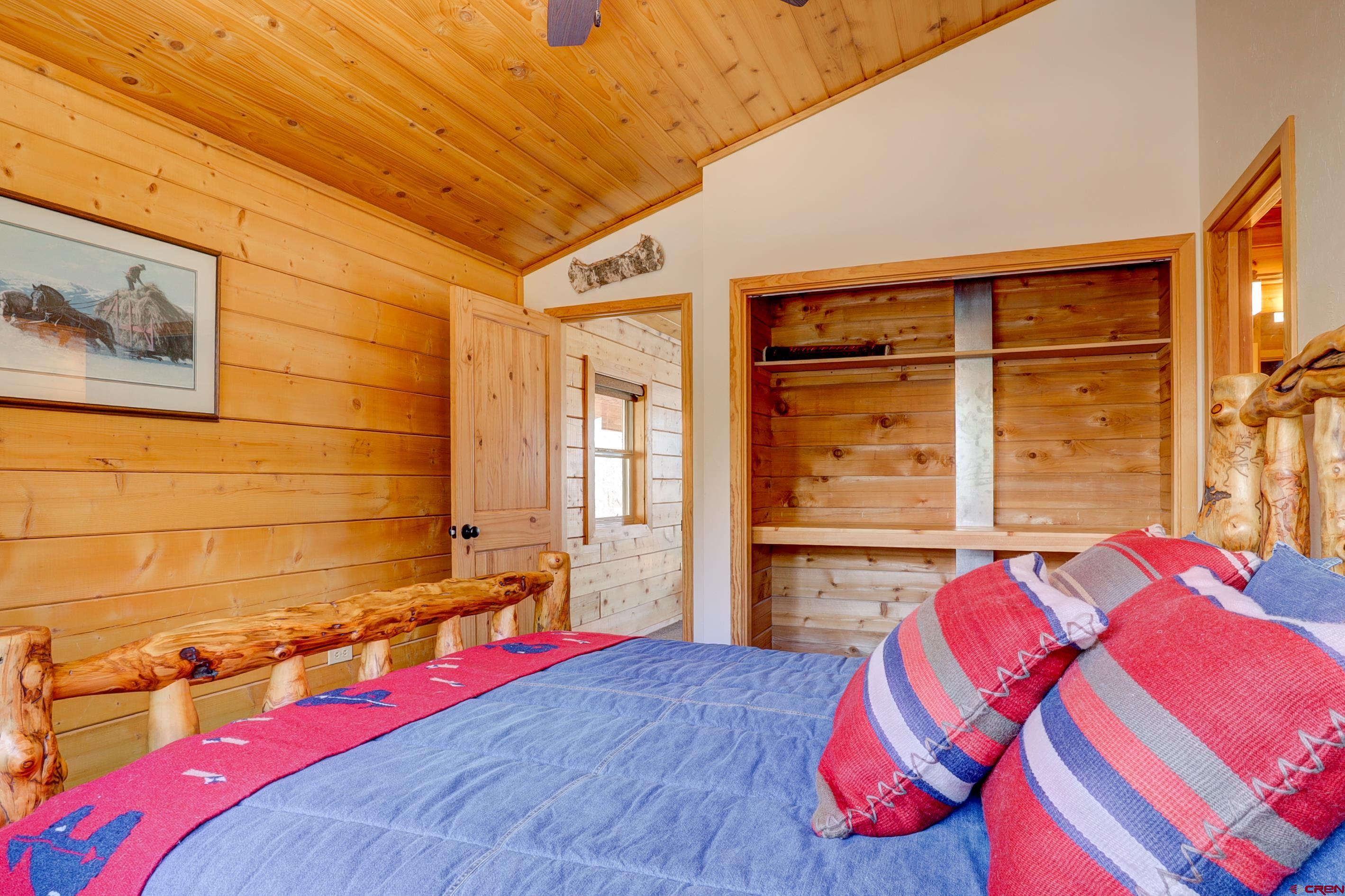 25112 Road 38.1 Dolores, CO 81323 - Photo 27 of 35 a bedroom with a bed and a window